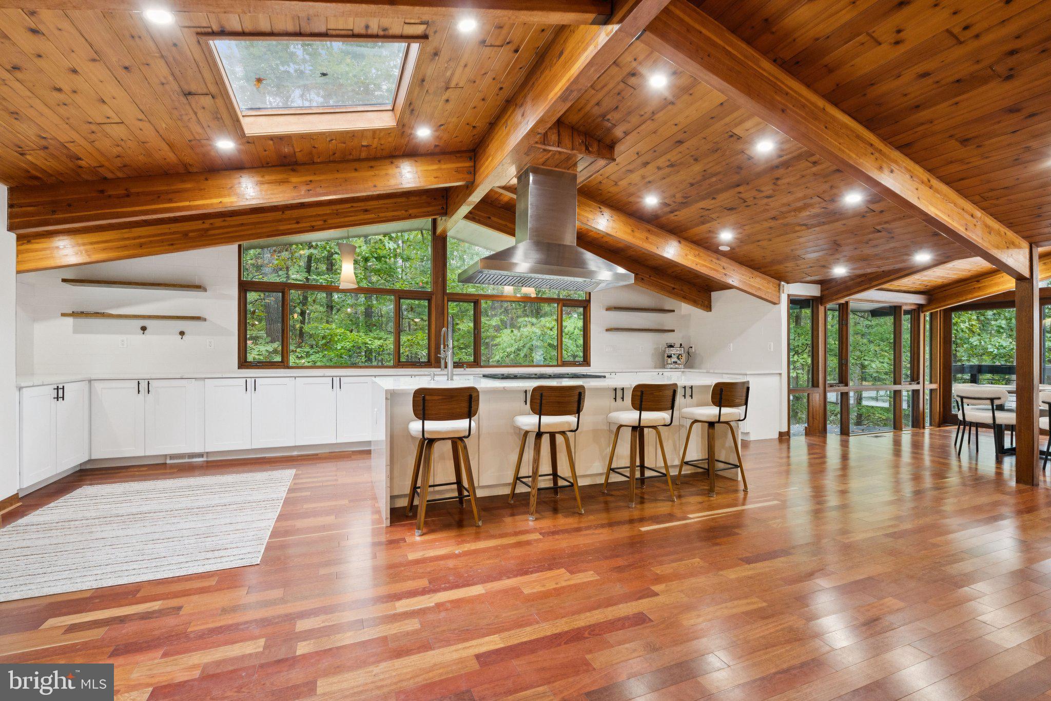 11428 Purple Beech Drive Reston, VA 20191 - Photo 7 of 52 a roof deck with dining table and chairs with wooden floor
