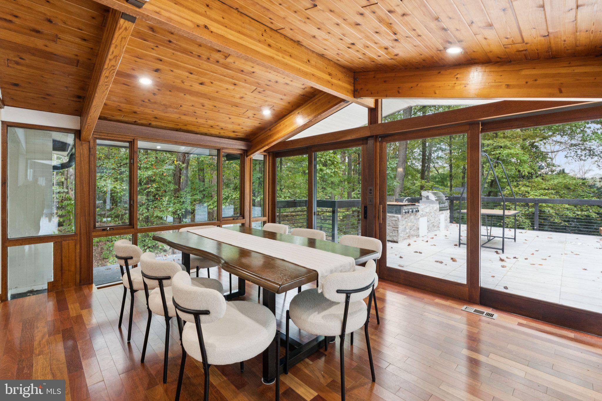 11428 Purple Beech Drive Reston, VA 20191 - Photo 8 of 52 a view of a dining room with furniture and wooden floor