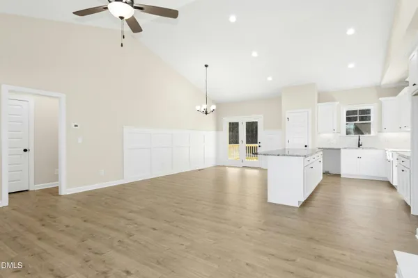 a view of kitchen with furniture and wooden floor