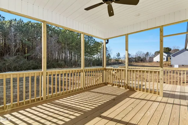a view of a balcony with wooden floor