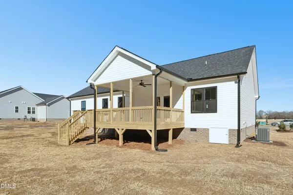 a view of a house with a snow in the background