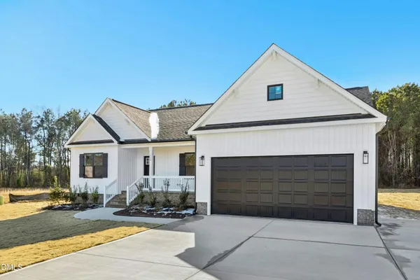 a front view of a house with yard