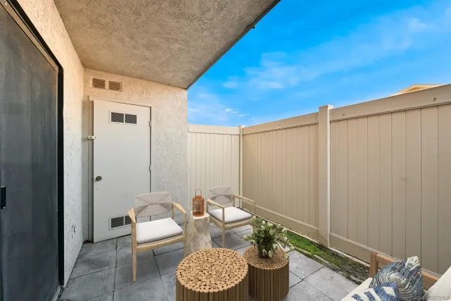 a bathroom with a toilet and a mirror