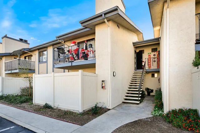 a front view of a house with stairs