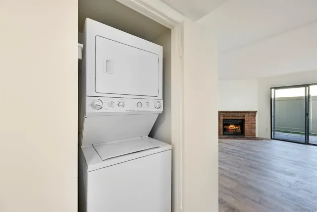 a view of a hallway with washer and dryer