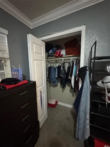 a living room with a fireplace furniture and a flat screen tv