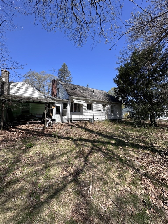 514 Dewey Street West Springfield, MA 01089 - Photo 7 of 13 a view of a house with backyard and a tree