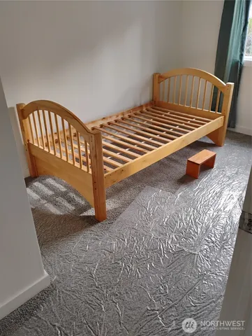 a view of a small house with yard