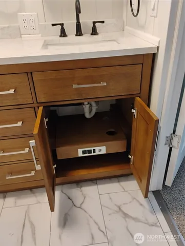 a front view of a house with a yard table and chairs