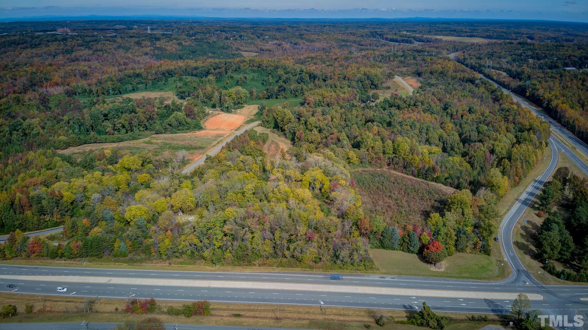 0 Adams Road Reidsville, NC 27320 - Photo 19 of 20 an aerial view of a houses with a yard and lake view