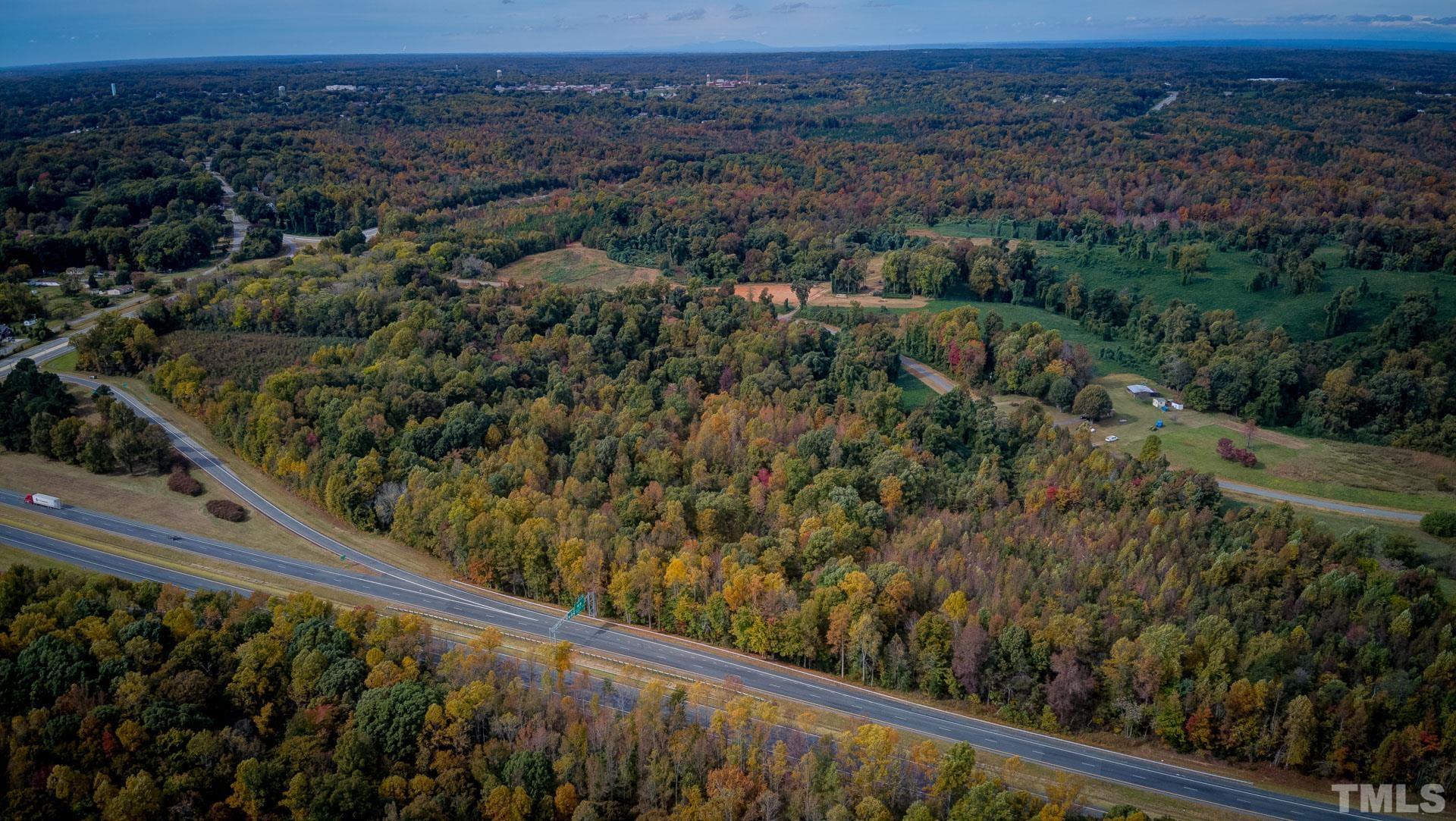 0 Adams Road Reidsville, NC 27320 - Photo 2 of 20 a view of a yard with a wooden fence