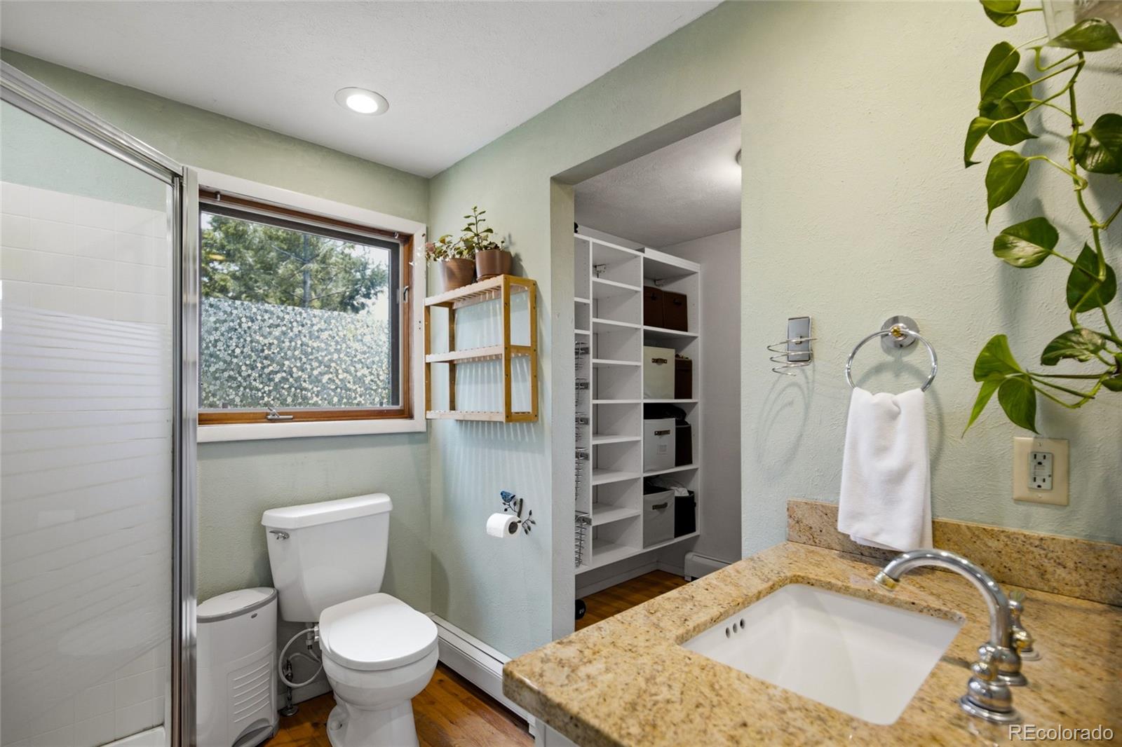 31280 Florence Road Conifer, CO 80433 - Photo 20 of 48 a bathroom with a sink toilet and shower