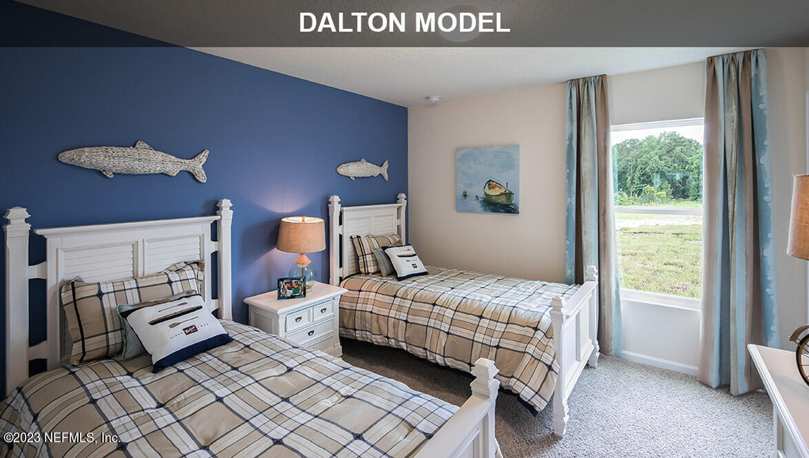 65792 Edgewater Drive Yulee, FL 32097 - Photo 13 of 45 a bedroom with a bed and window