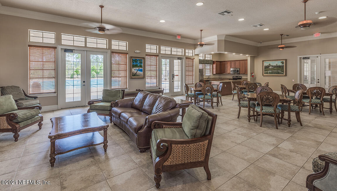 65792 Edgewater Drive Yulee, FL 32097 - Photo 19 of 45 a living room with furniture and a large window