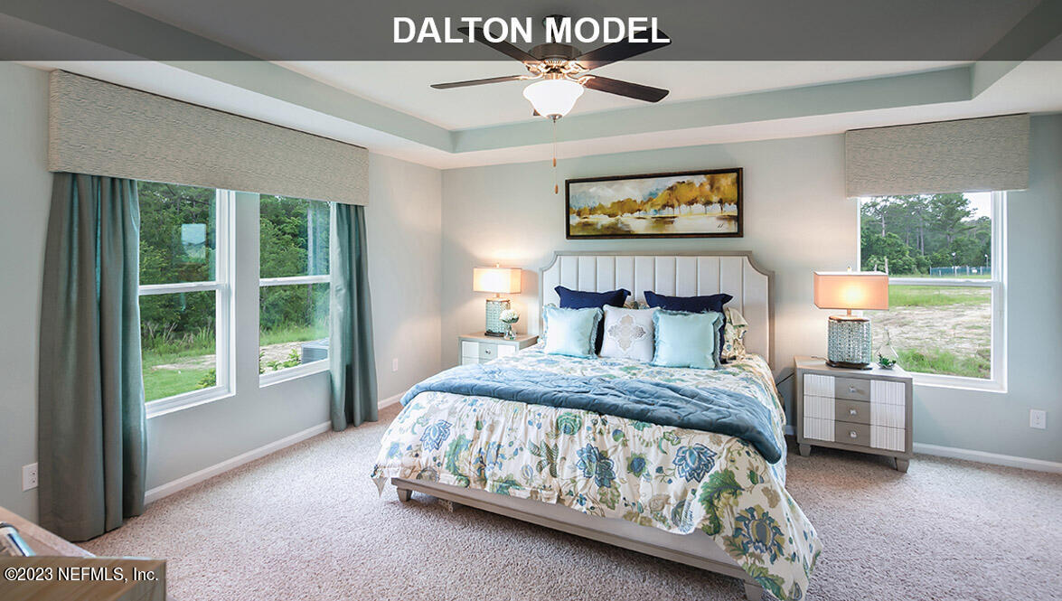 65792 Edgewater Drive Yulee, FL 32097 - Photo 9 of 45 a bedroom with a bed and a window