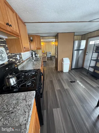 a view of a living room and wooden floor