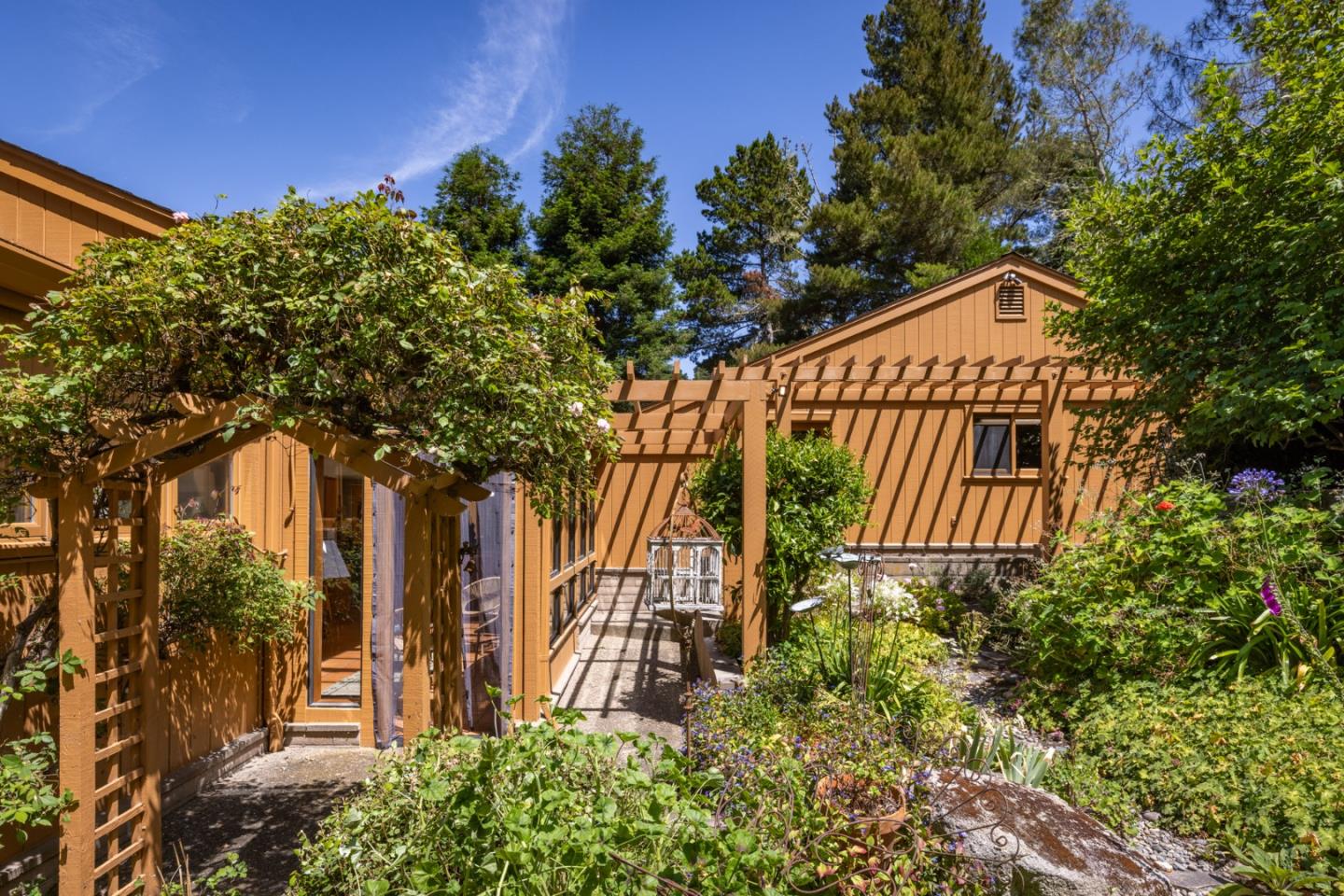 540 Aguajito Road Carmel, CA 93923 - Photo 18 of 32 front view of a house with a tree