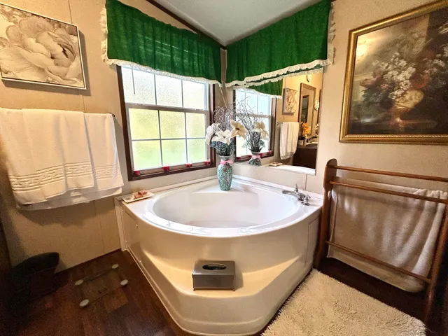 a bath tub sitting next to a window