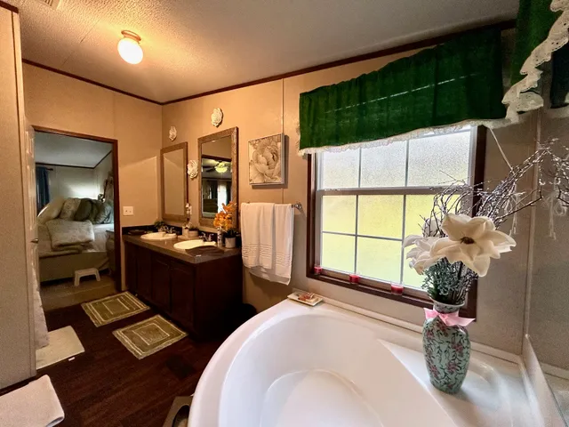 a room with musical instrument pool table and windows