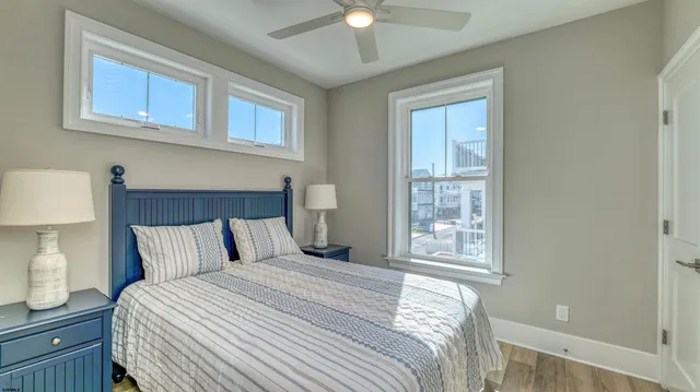 a bedroom with a bed and a night stand