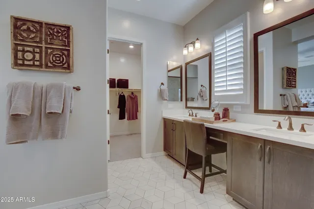 a bathroom with a sink a mirror and a shower