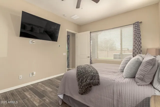 a bathroom with a granite countertop sink a toilet and shower
