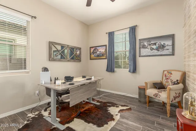 a reading room with furniture and wooden floor