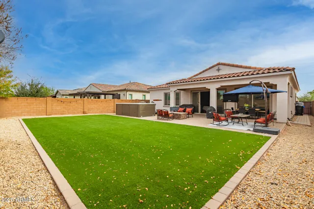 a view of a house with a yard porch and sitting area