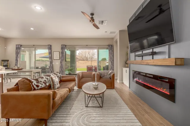 a kitchen with a table chairs refrigerator and microwave