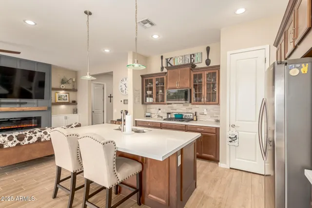 a large kitchen with a table and chairs