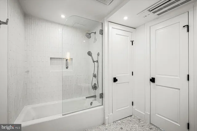 a bathroom with a shower and a bathtub