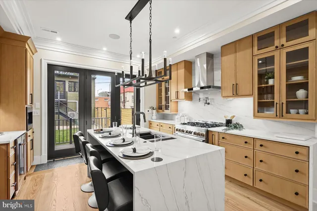 a kitchen with a sink stove and cabinets