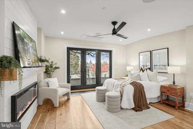 a bedroom with furniture and wooden floor