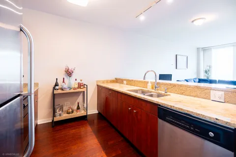 a kitchen with sink and cabinets