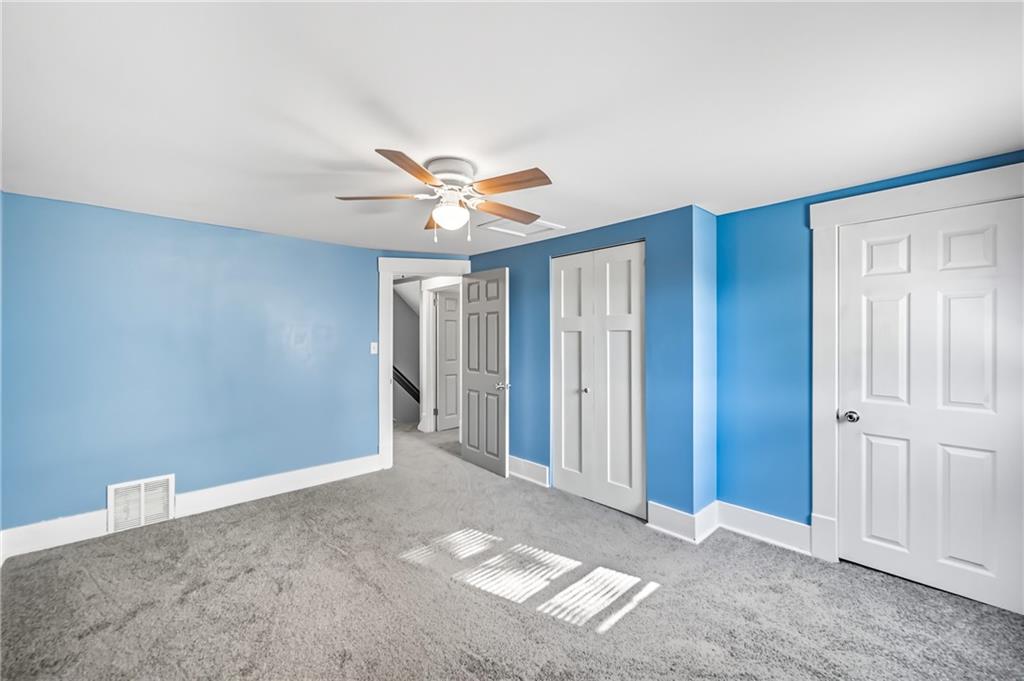 1039 North Keel Ridge Road Hermitage, PA 16148 - Photo 24 of 47 an empty room with closet and windows