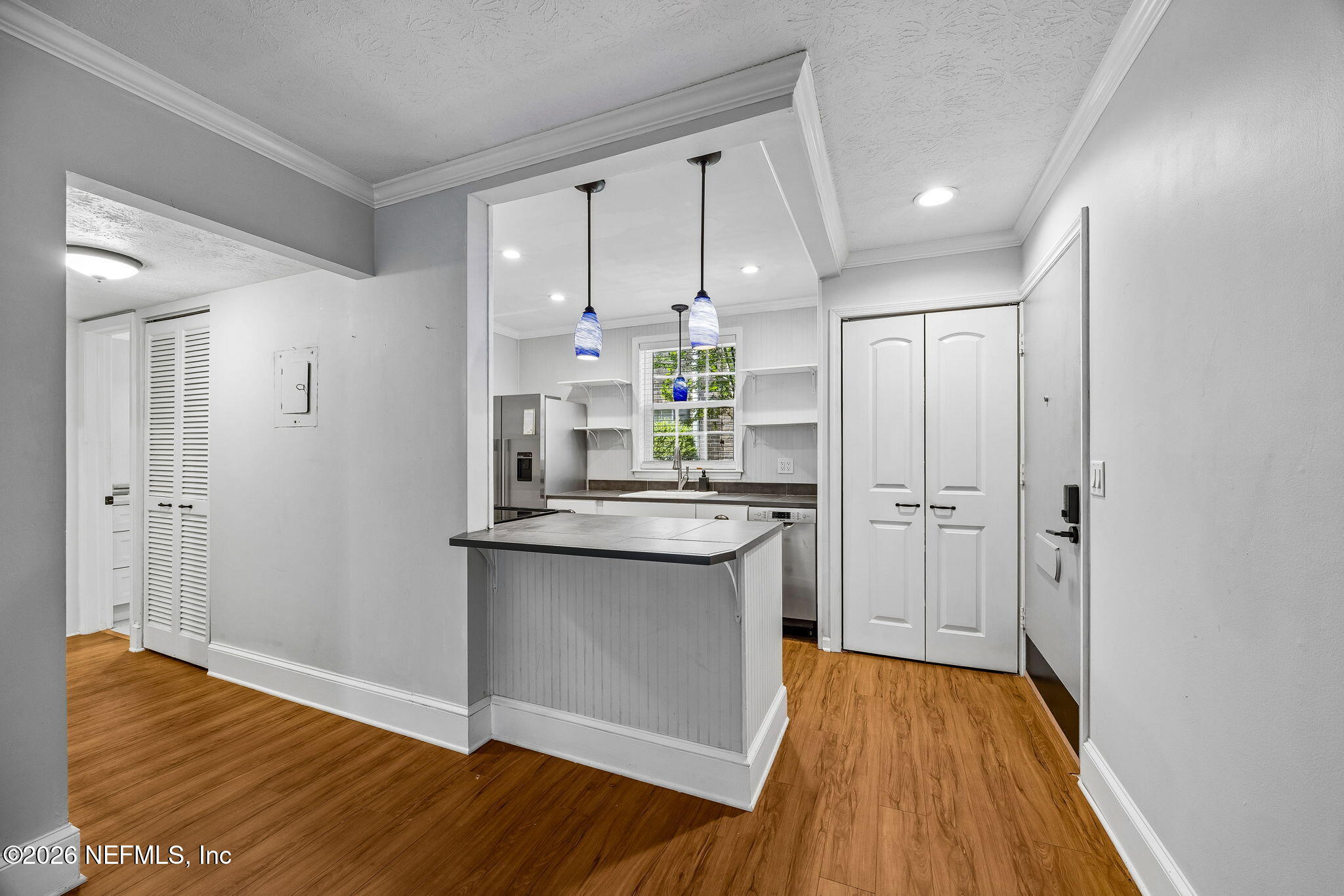 4358 Timuquana Road, Unit 134 Jacksonville, FL 32210 - Photo 6 of 31 a kitchen with stainless steel appliances a refrigerator and a stove top oven
