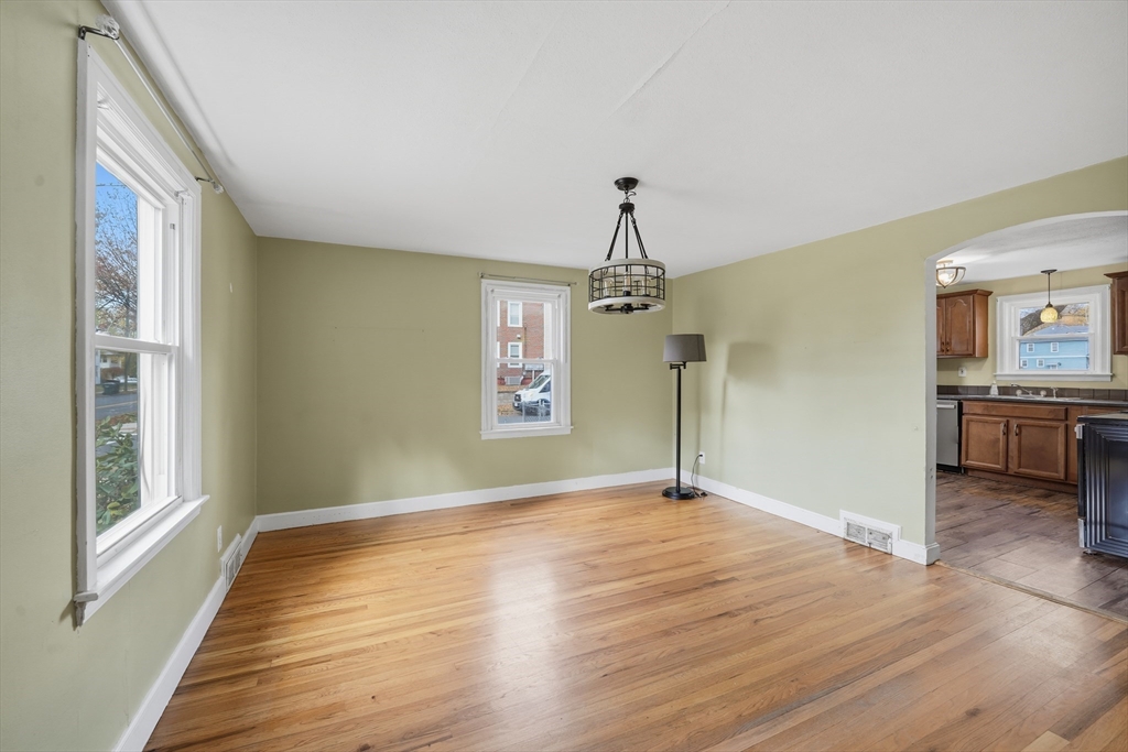 803 Armory Street Springfield, MA 01107 - Photo 15 of 34 a view of a livingroom with a chandelier