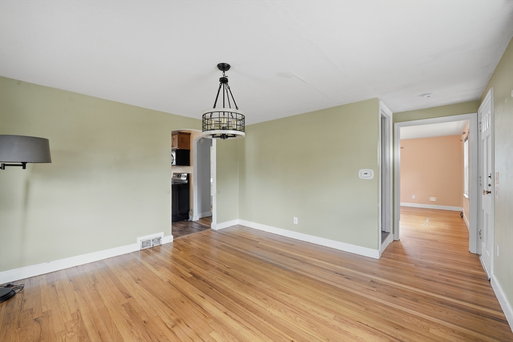 803 Armory Street Springfield, MA 01107 - Photo 16 of 34 a view of empty room with wooden floor