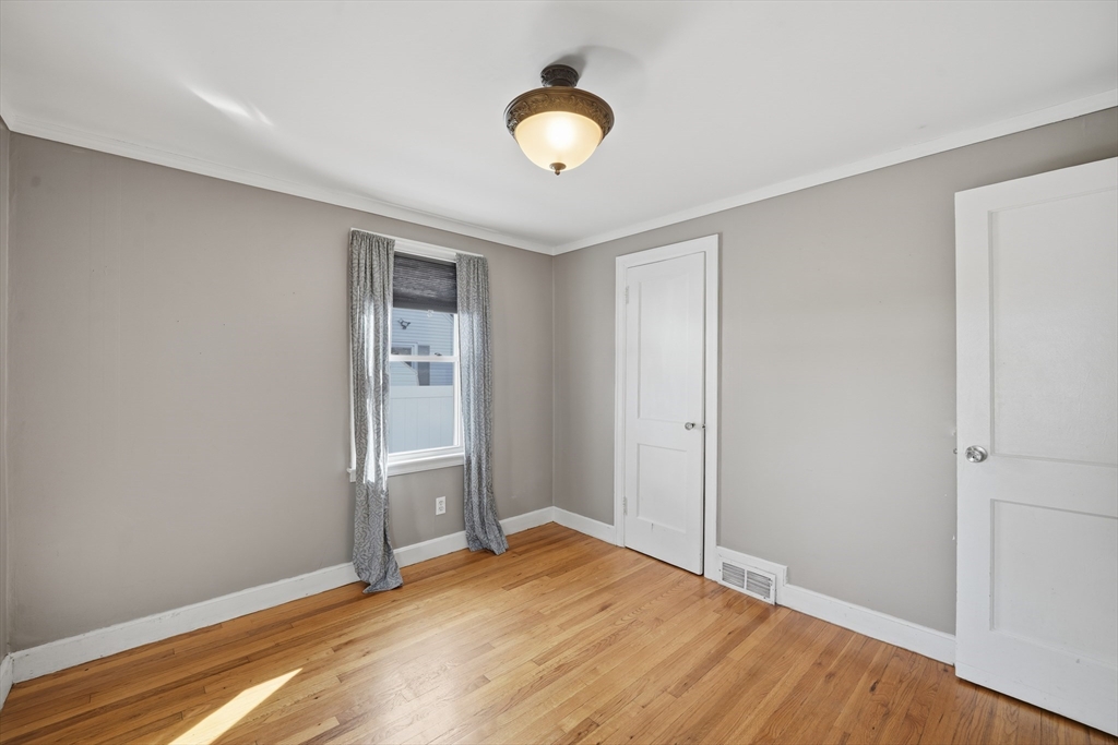 803 Armory Street Springfield, MA 01107 - Photo 22 of 34 a view of an empty room and window