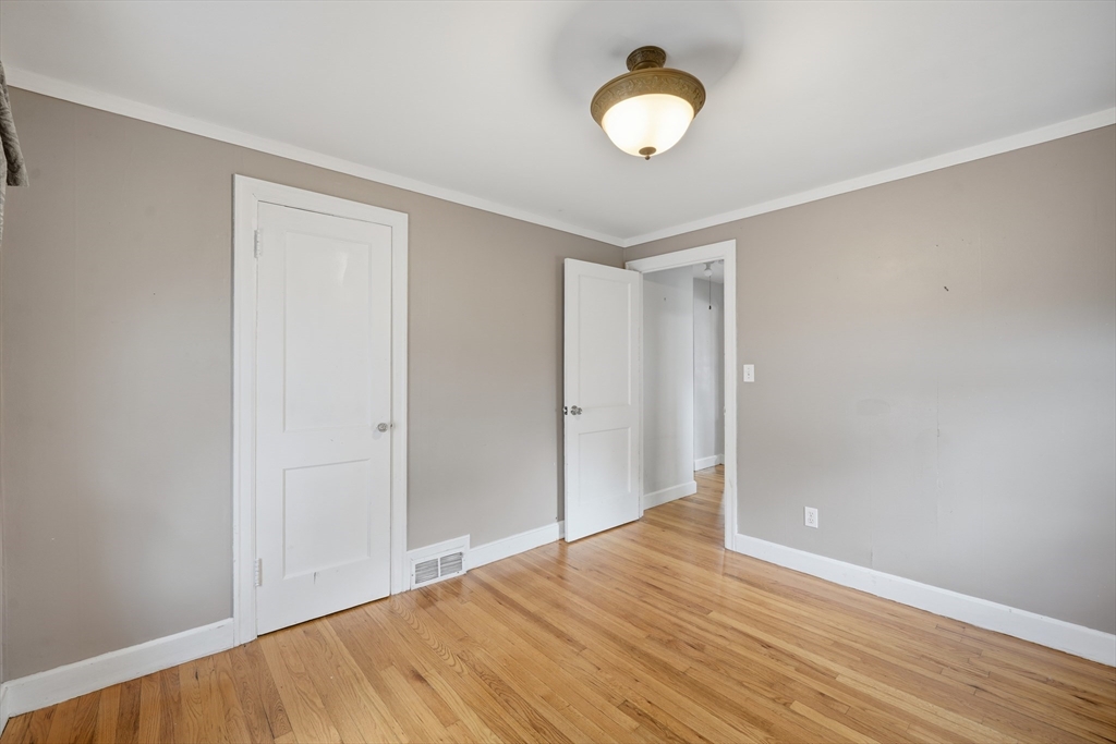 803 Armory Street Springfield, MA 01107 - Photo 25 of 34 a view of empty room with wooden floor