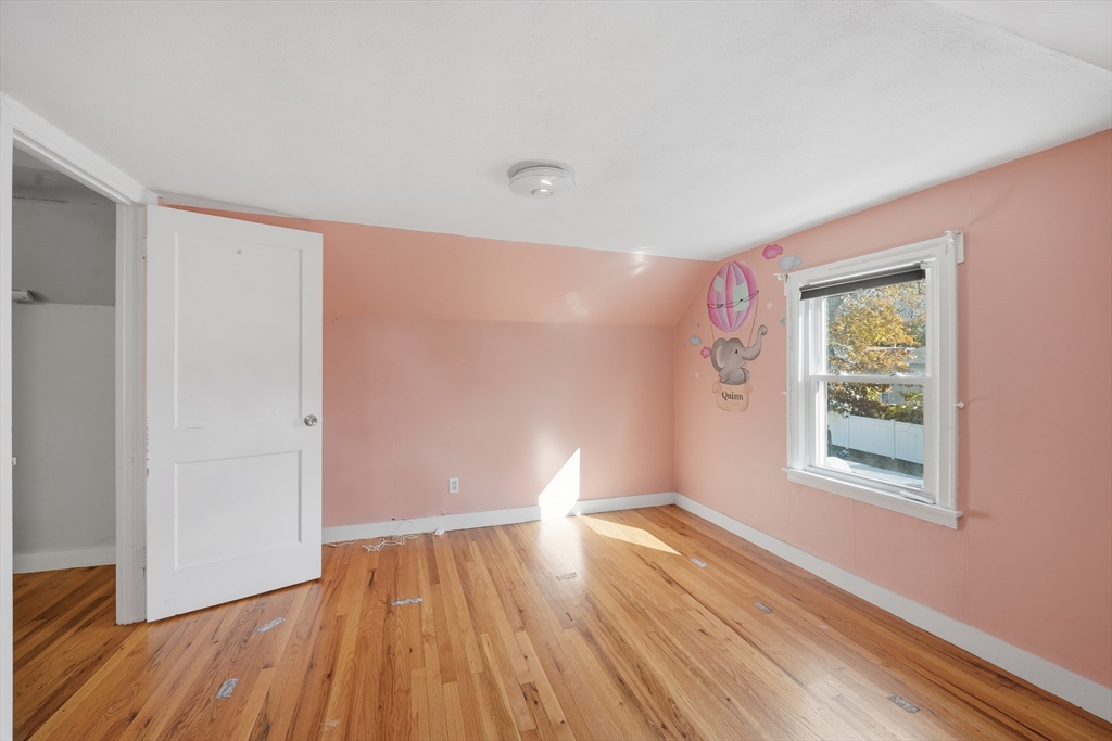 803 Armory Street Springfield, MA 01107 - Photo 26 of 34 a view of empty room with wooden floor and fan