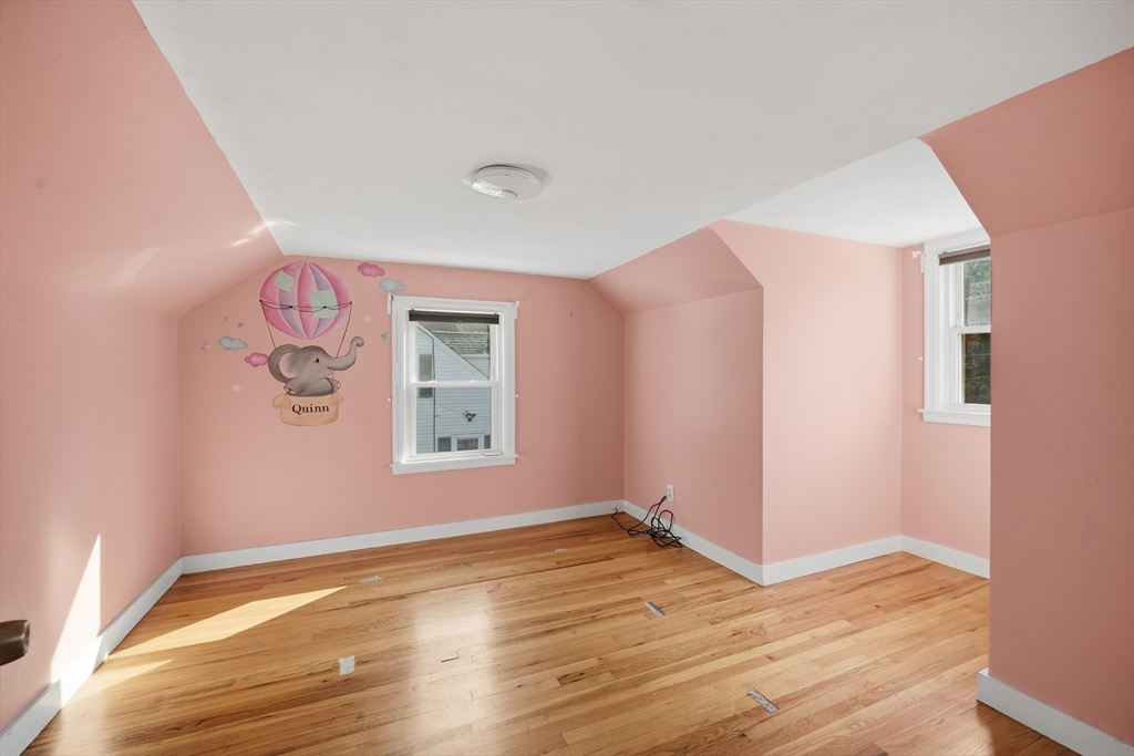 803 Armory Street Springfield, MA 01107 - Photo 28 of 34 a view of empty room with wooden floor and fan