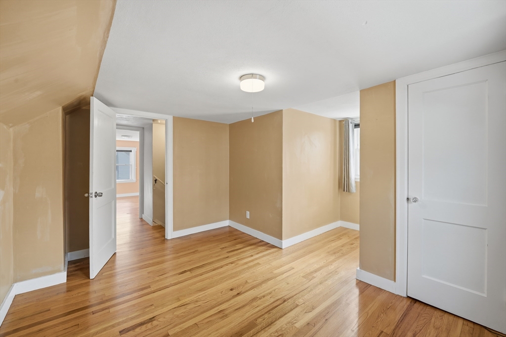 803 Armory Street Springfield, MA 01107 - Photo 30 of 34 a view of an empty room with wooden floor
