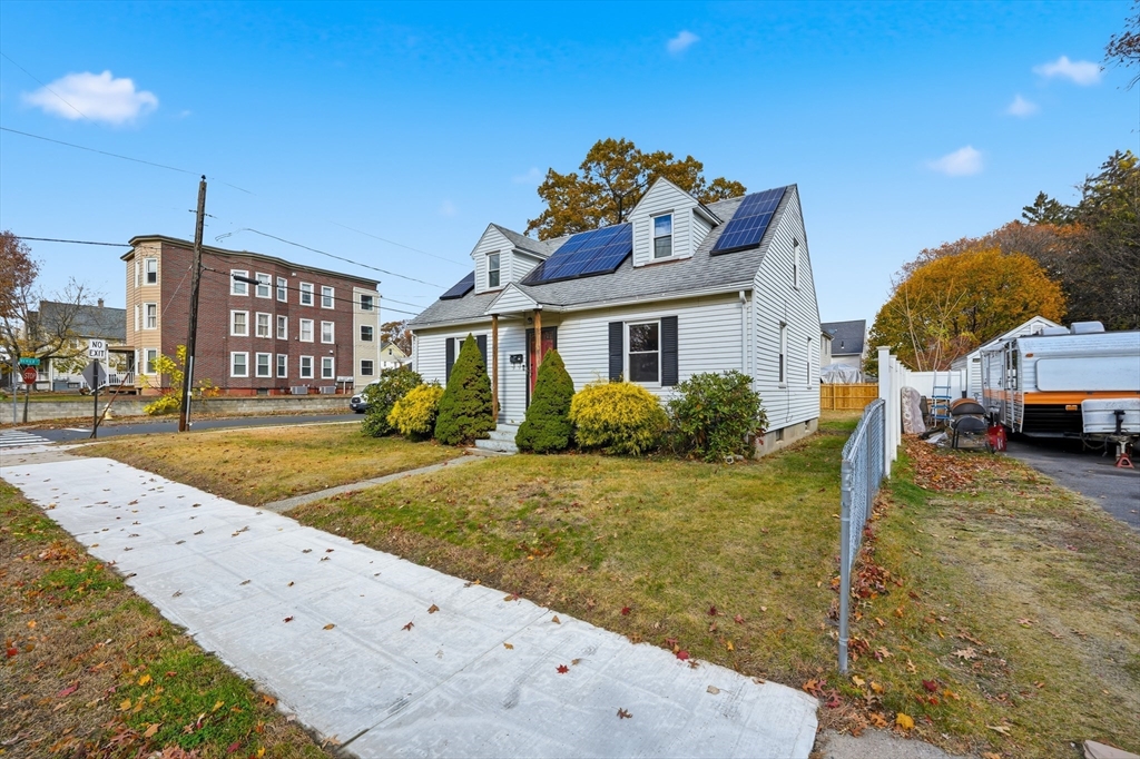 803 Armory Street Springfield, MA 01107 - Photo 3 of 34 a front view of a house with garden