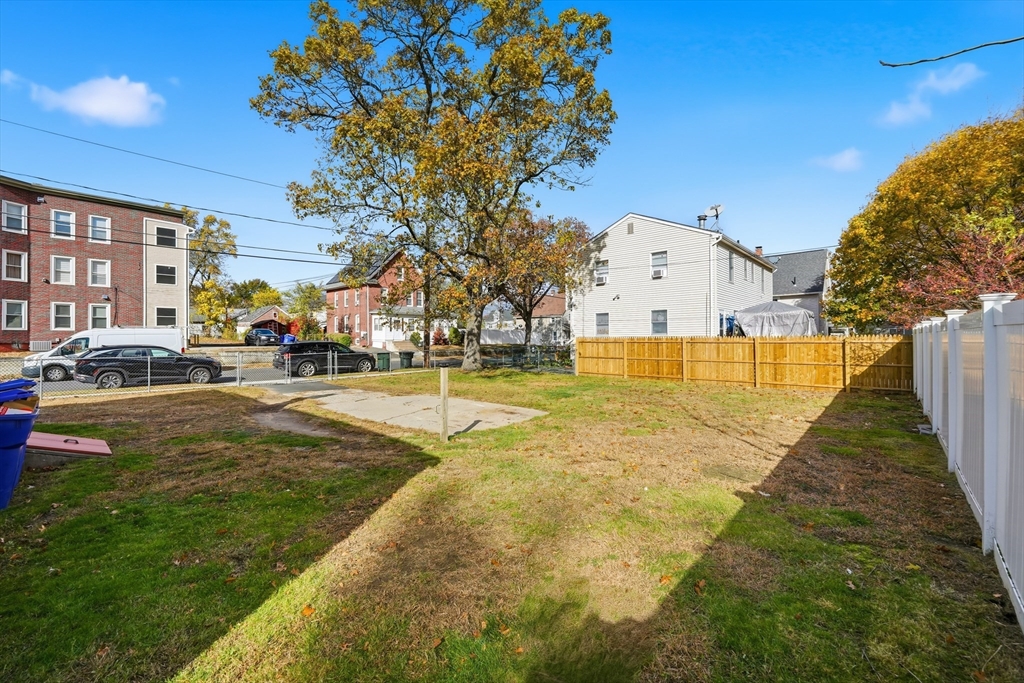 803 Armory Street Springfield, MA 01107 - Photo 4 of 34 a view of residential houses with yard