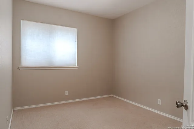 a bathroom with a toilet a sink and a mirror