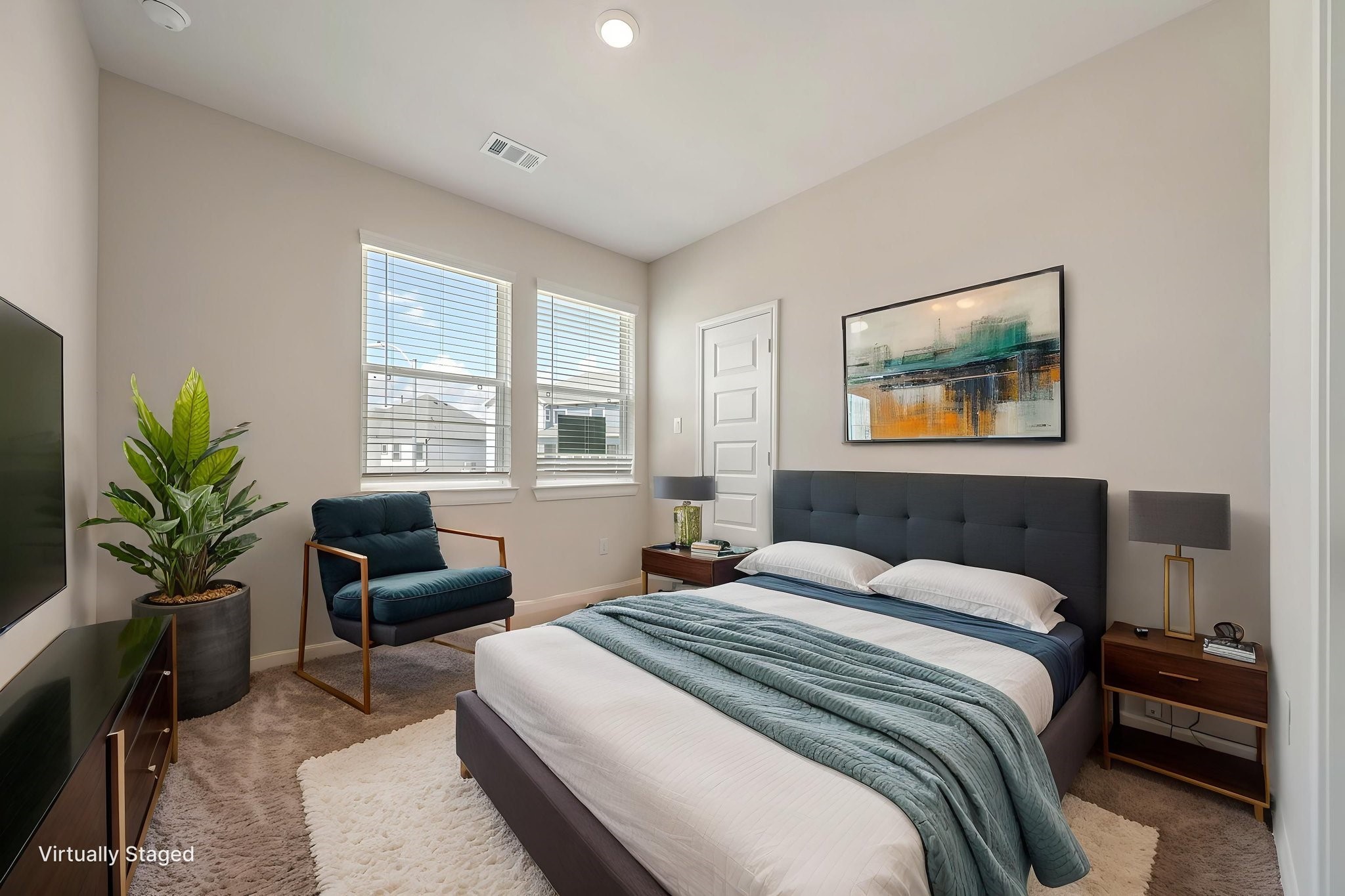 20629 Dynamic Court Humble, TX 77338 - Photo 22 of 26 a bedroom with a balcony a bed a couch and potted plant on the dresser