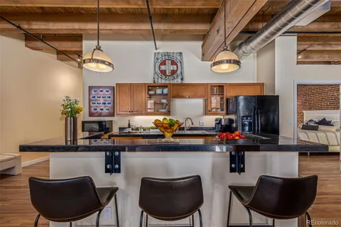 a kitchen with a table and chairs