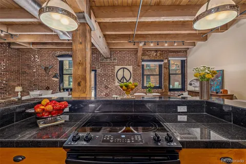 a kitchen has a stove and a table