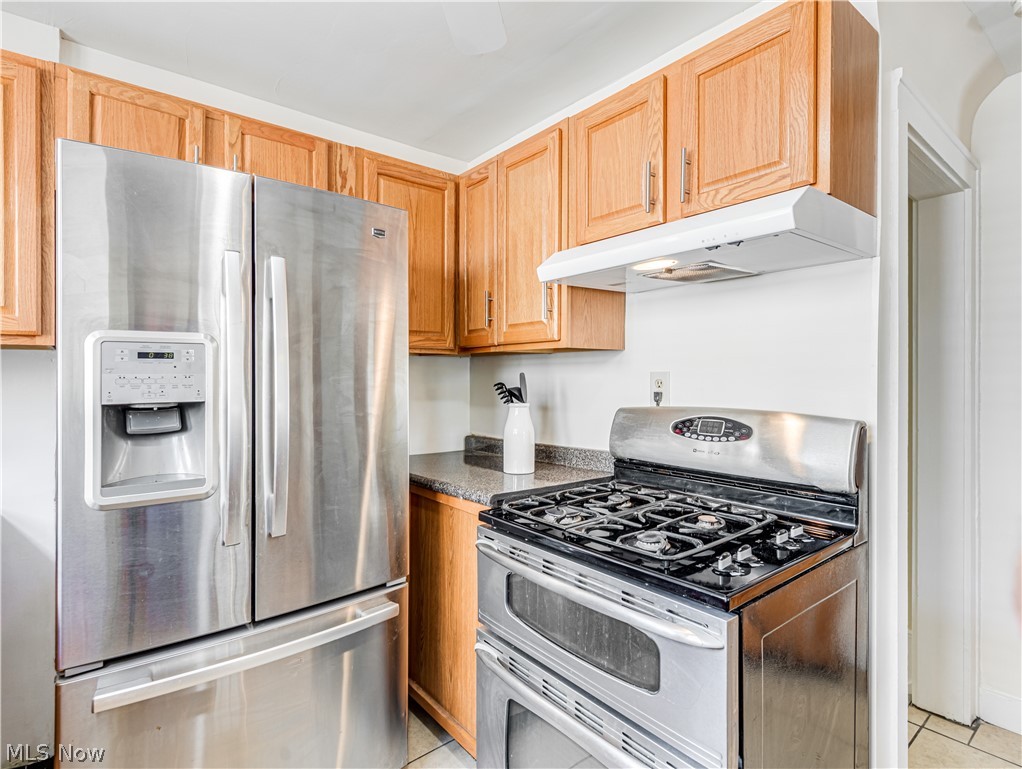 377 East Wilbeth Road Akron, OH 44301 - Photo 10 of 25 Kitchen featuring light tile floors and stainless steel appliances